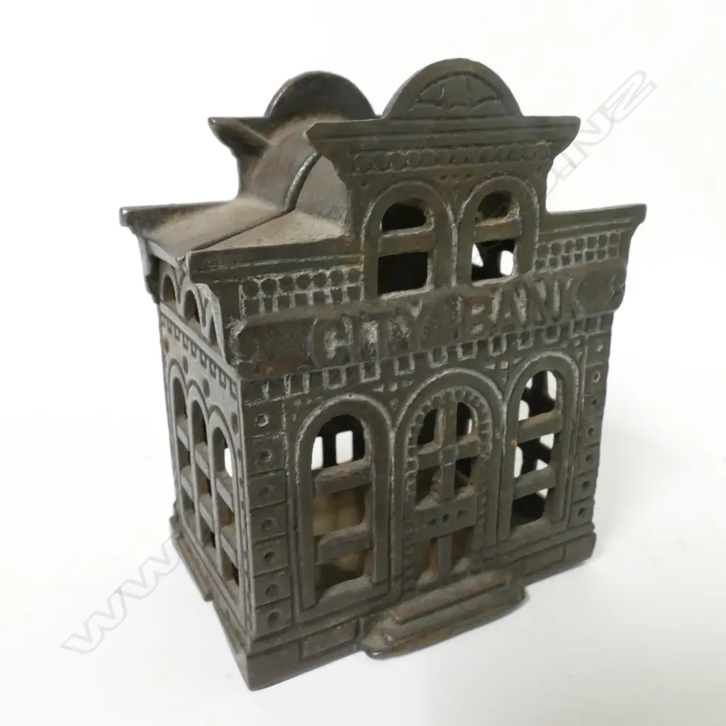 A vintage cast iron money box Image 1++