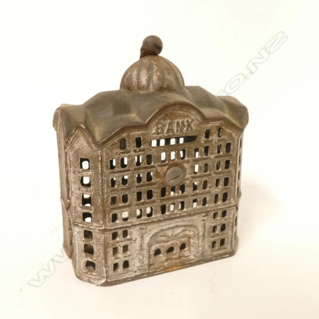 A vintage cast iron money box in the form of a bank building Image 1++