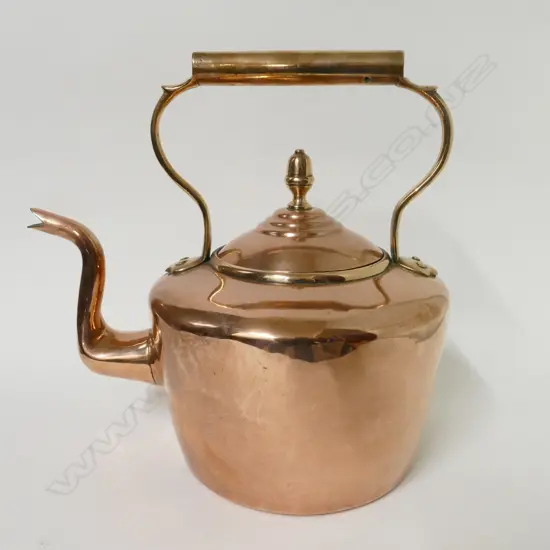 A large Victorian copper kettle
