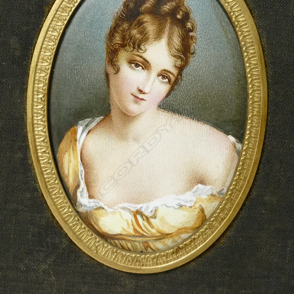 A pair of hand painted enamel portrait miniatures Image 1++