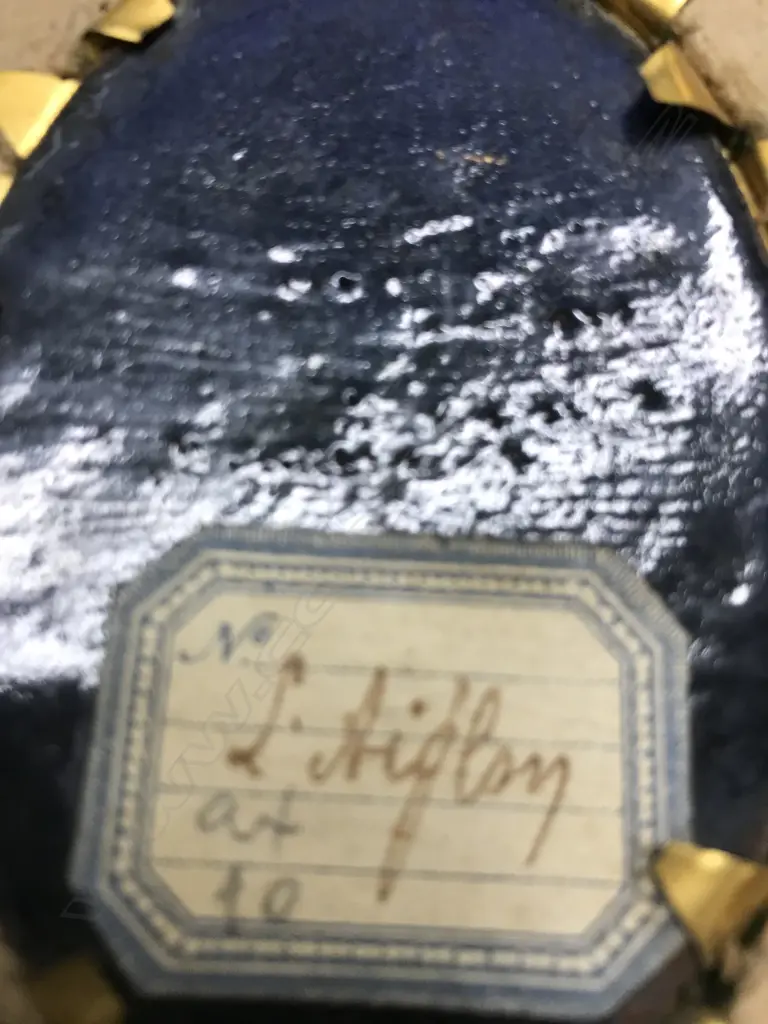 A pair of hand painted enamel portrait miniatures Image 1++