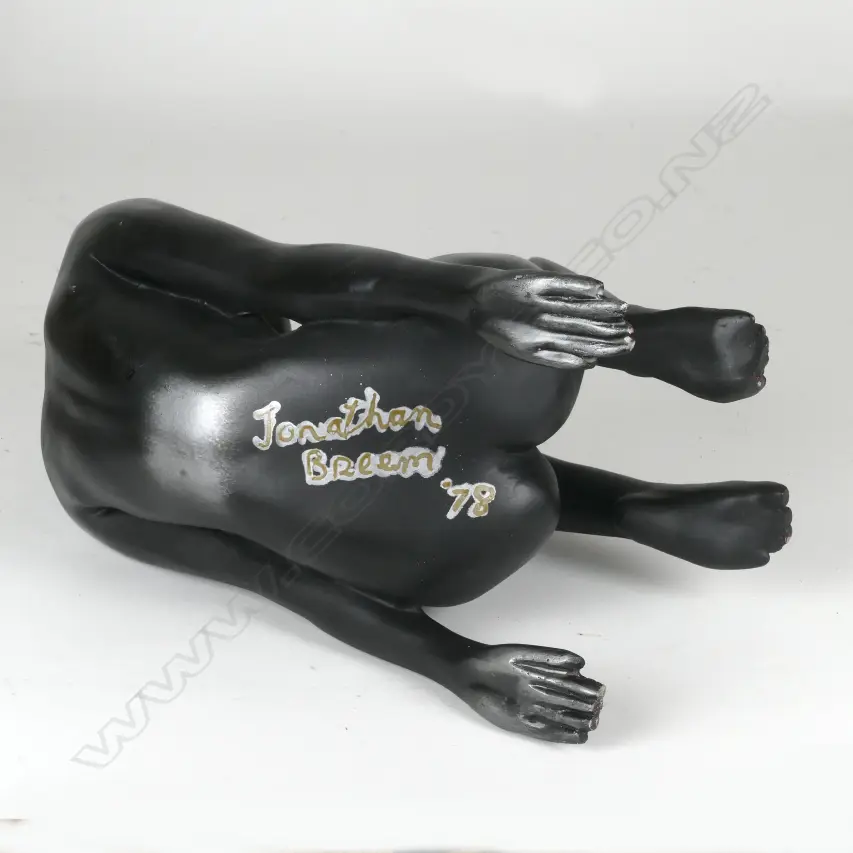 A white metal patinated sculpture of a naked woman Image 1++