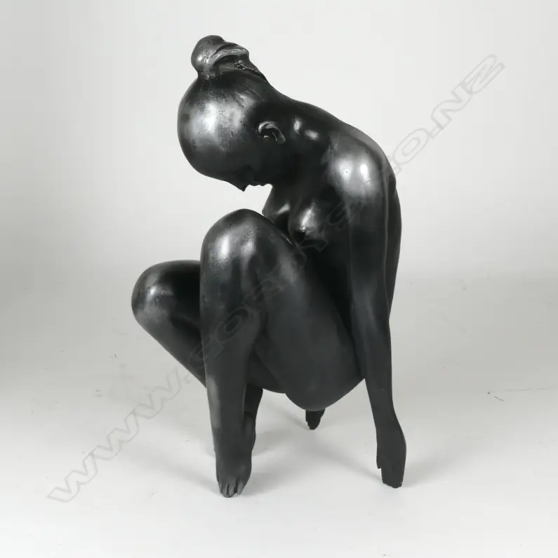 A white metal patinated sculpture of a naked woman Image 1++