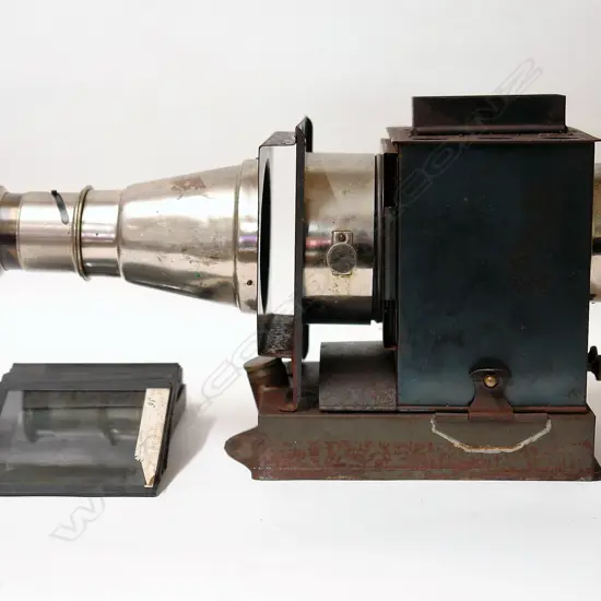 A vintage tin and chrome magic lantern