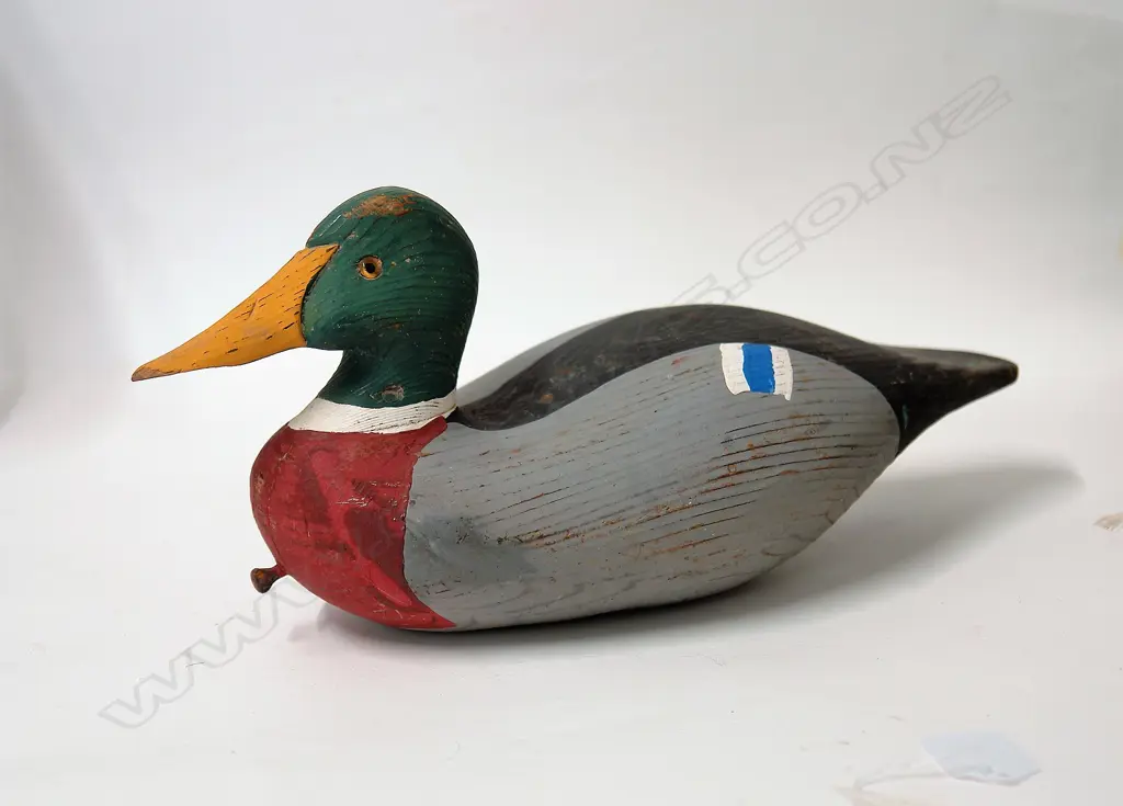 A vintage carved and painted duck decoy Image 1++