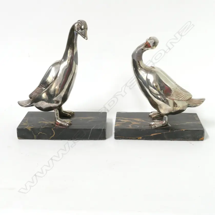 A pair of sculptural bookends modelled as silver plated geese Image 1++