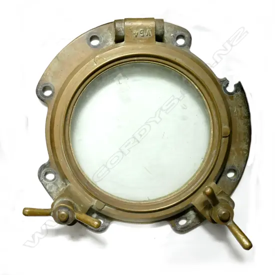 An old brass ship's porthole window
