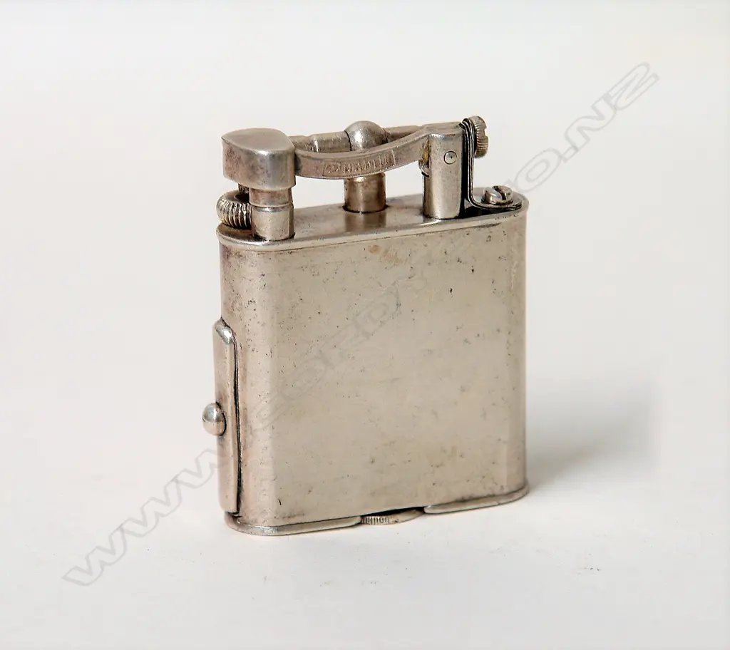 A vintage Dunhill silver plate lighter Image 1++