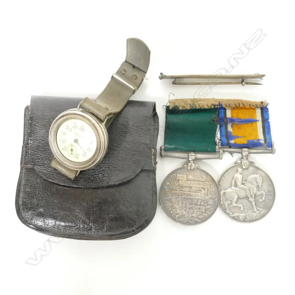 A WWI service medal and a George V Volunteer Long Service Medal Image 1++