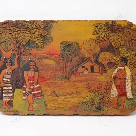 A 1943 Jane Brenkley carved and painted Maori themed table-top/wall plaque