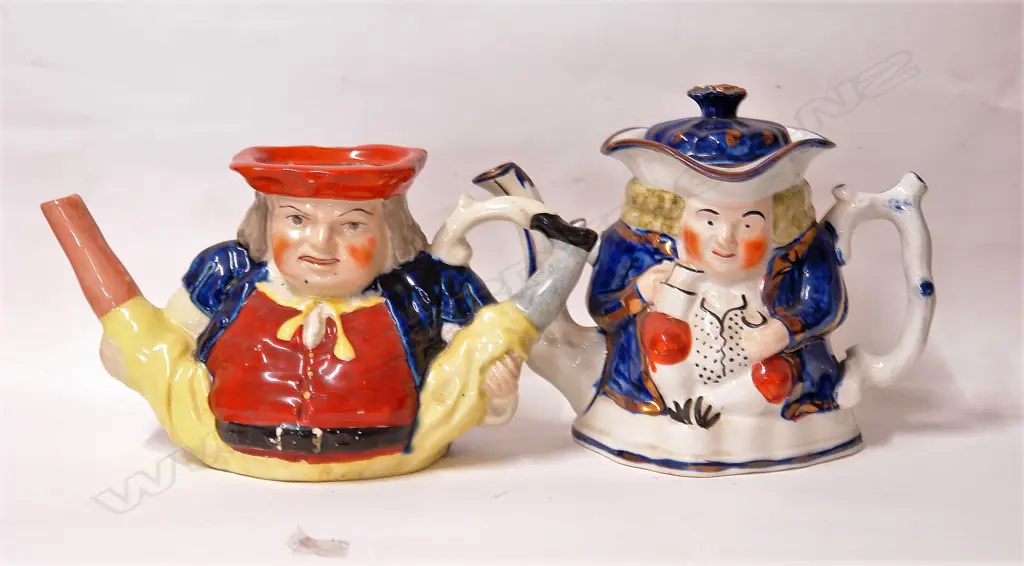 Two 19thC Staffordshire figured teapots Image 1++