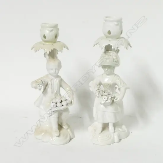 A pair of Derby whiteware figural candlesticks