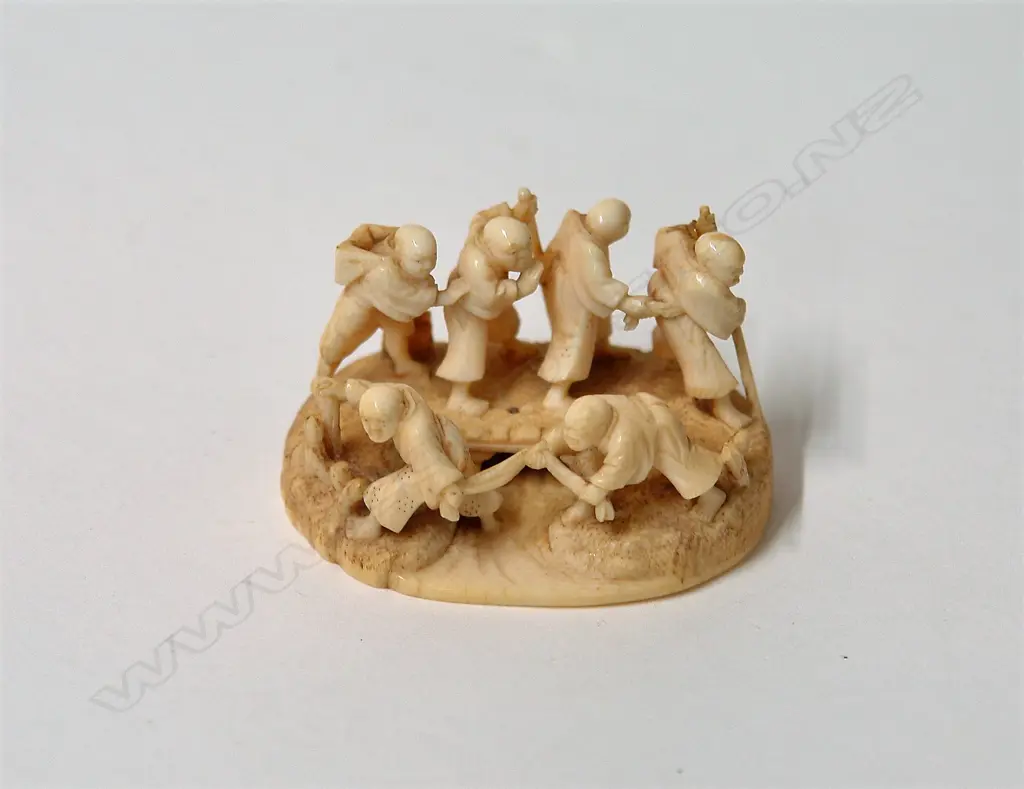A fine old Japanese carved okimono of six blind travellers Image 1++