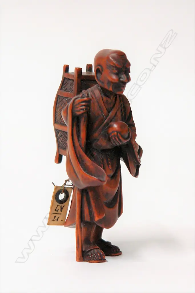 An old finely carved Japanese boxwood netsuke of a Sennin Image 1++