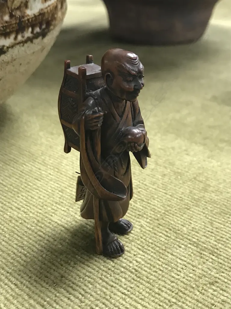 An old finely carved Japanese boxwood netsuke of a Sennin Image 1++