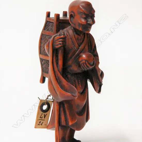 An old finely carved Japanese boxwood netsuke of a Sennin