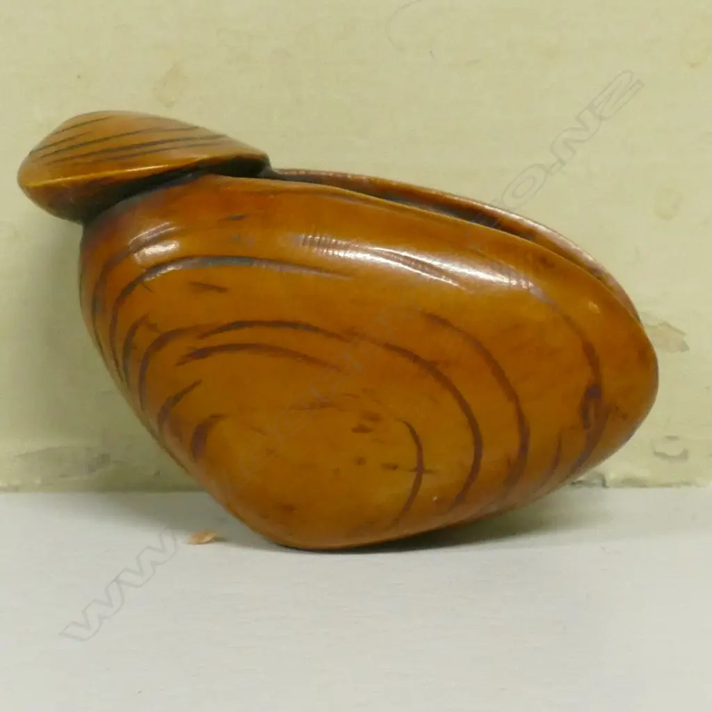 An old stained and carved ivory dreamshell netsuke Image 1++