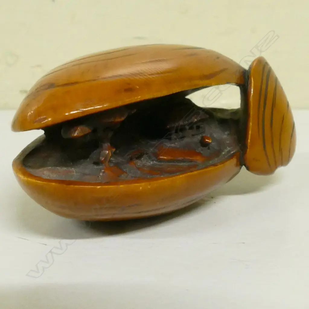 An old stained and carved ivory dreamshell netsuke Image 1++