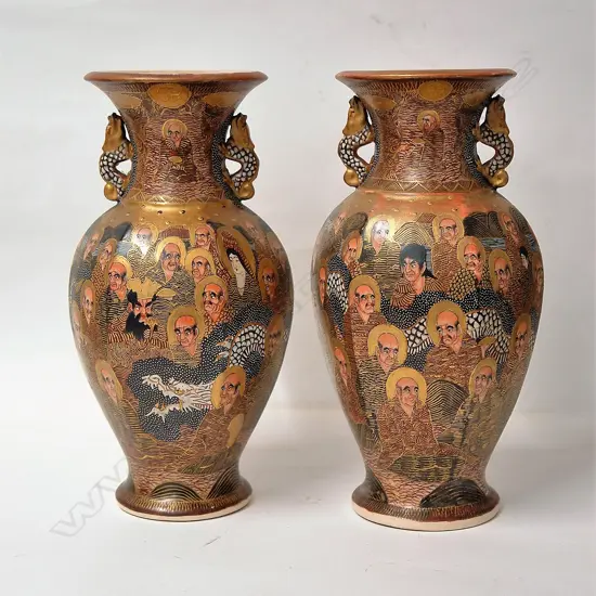 A pair of Japanese Meiji period vases in the 'Thousand Faces' pattern
