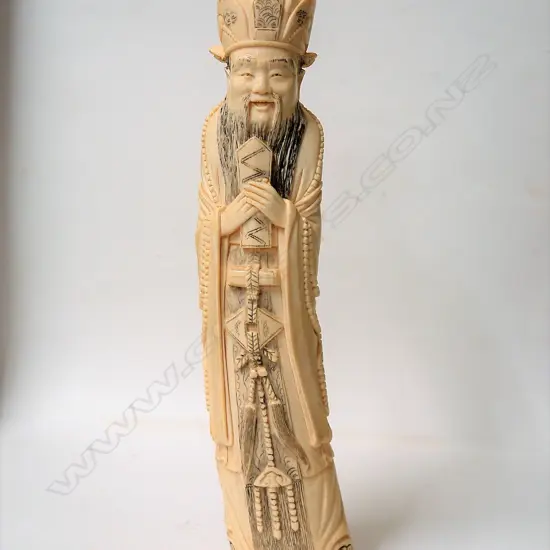 A Chinese large old carved ivory figure of an emperor