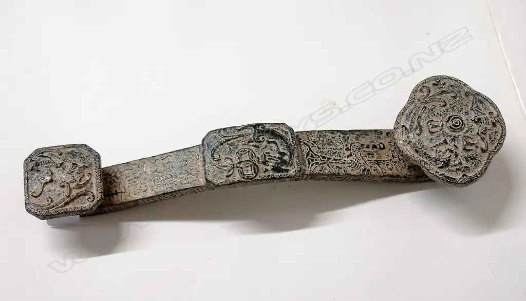 A Chinese archaic style dark green jade ruyi sceptre Image 1++