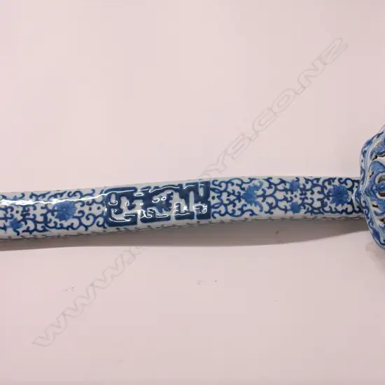 A Chinese porcelain blue and white decorated ruyi sceptre