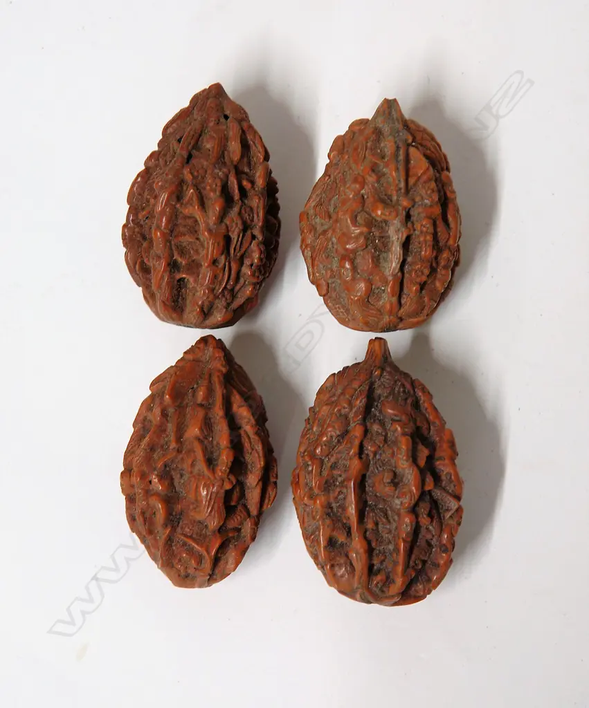 Four old Chinese finely carved walnuts Image 1++