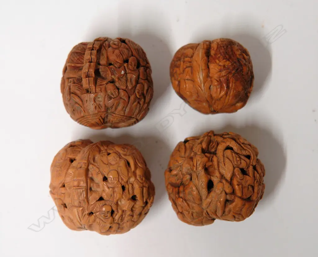 Four old Chinese finely carved walnuts Image 1++