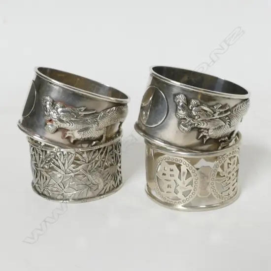 Four Chinese silver napkin rings