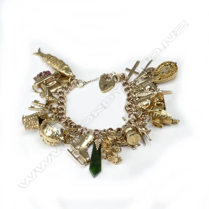 A 9ct. gold charm bracelet Image 1++