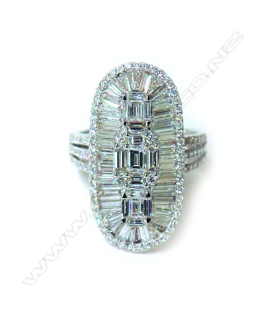 A lady's modern 18ct. white gold and multi-diamond cluster ring Image 1++