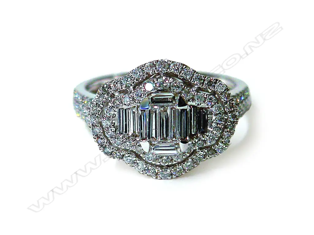 A lady's modern 18ct. white gold and diamond set cluster ring Image 1++