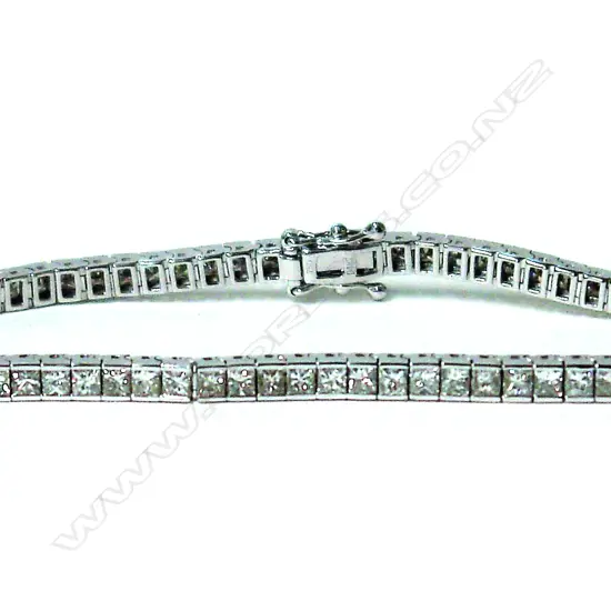 A lady's modern 18ct. white gold and diamond set tennis bracelet