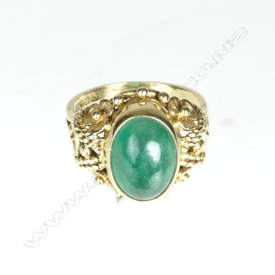 An estate 18ct. gold and emerald ring