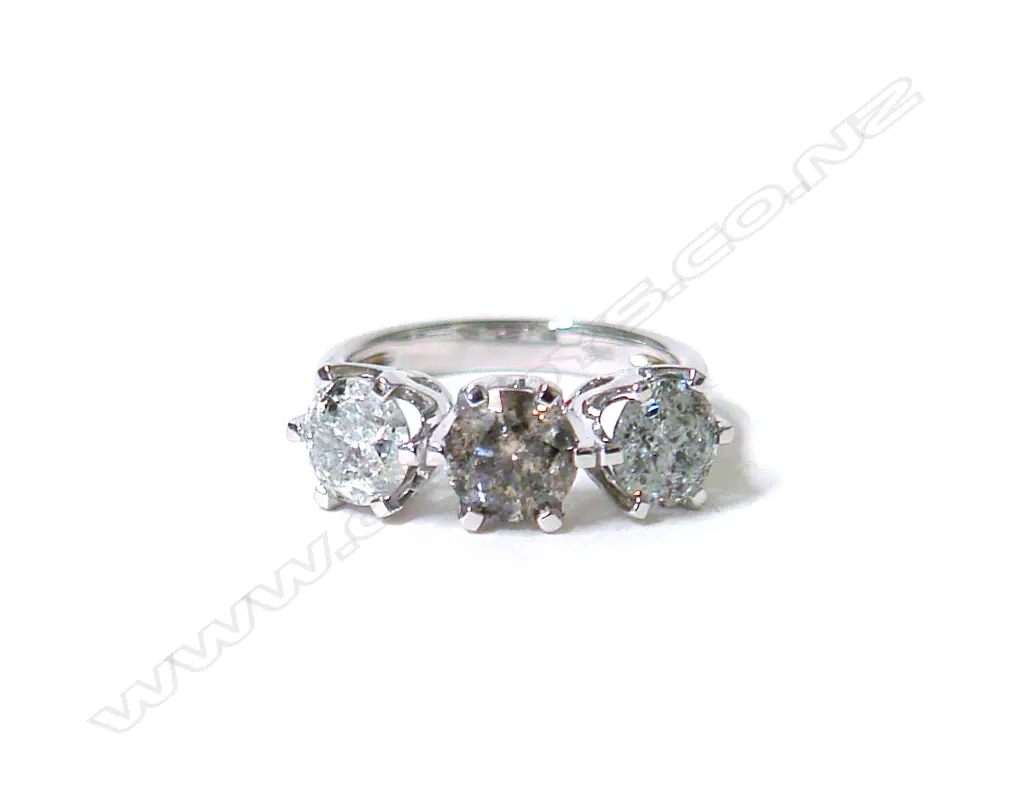 A modern 18ct. white gold large three-stone diamond ring Image 1++
