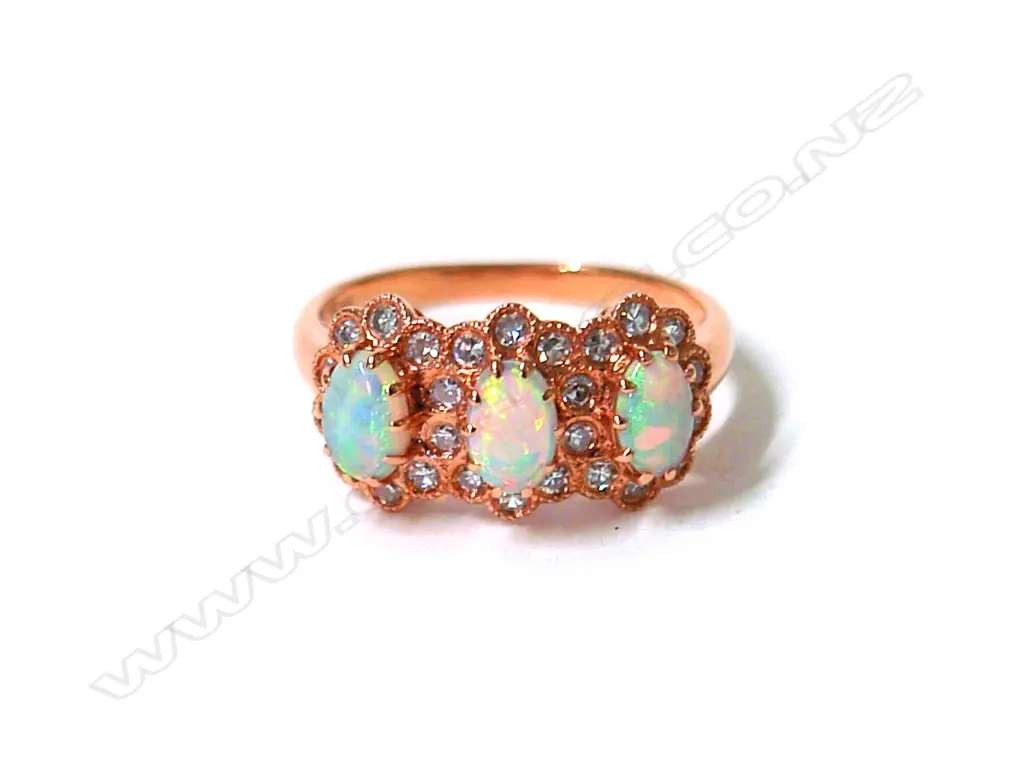A lady's modern 18ct. yellow gold three opal and diamond cluster ring Image 1++