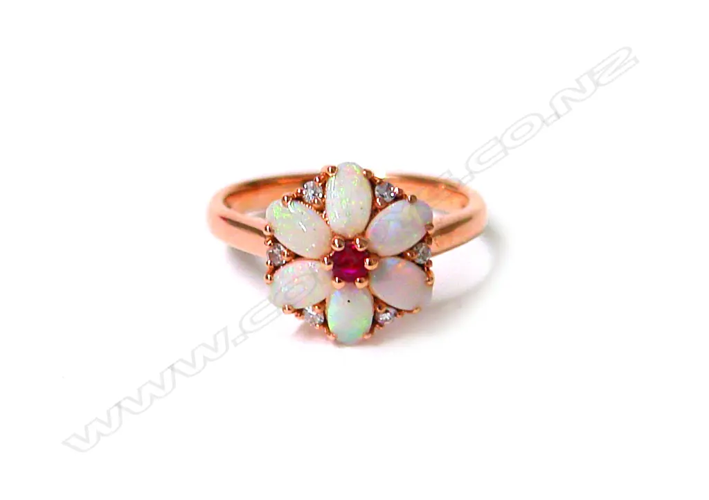 An 18ct. rose gold opal ruby and diamond cluster ring Image 1++