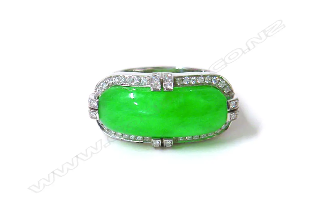 A modern substantial 18ct. white gold jade and diamond dress ring Image 1++