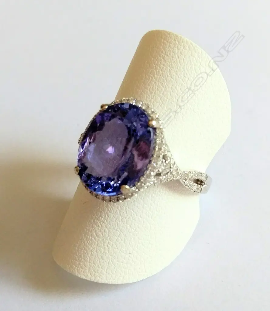 An 18ct white gold 5 carat tanzanite and diamond dress ring Image 1++