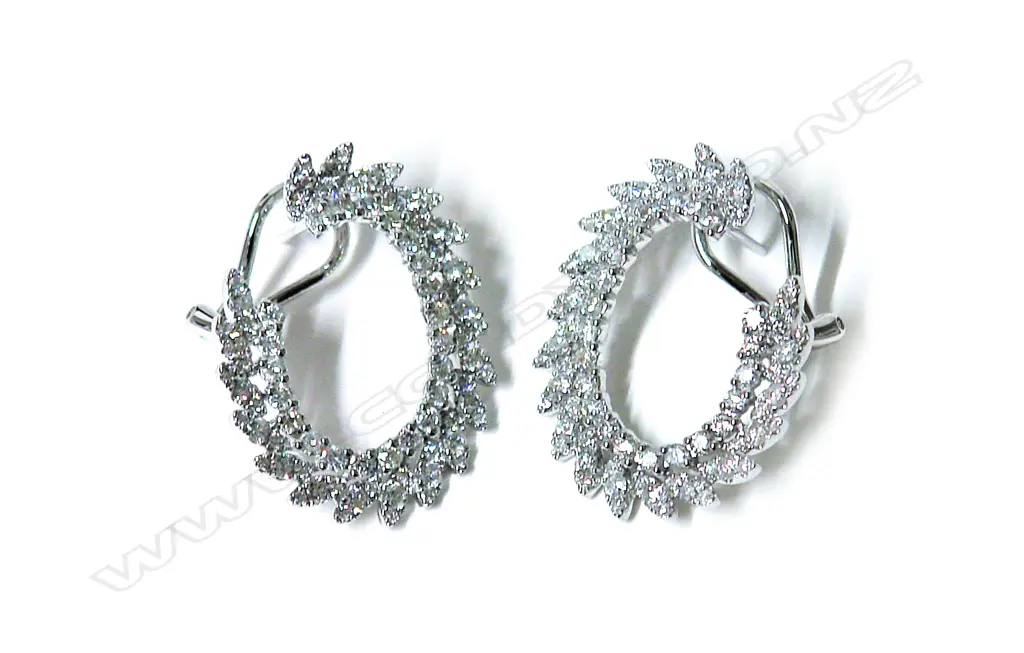 A pair of lady's modern 18ct. white gold and diamond three-quarter hoop earrings Image 1++
