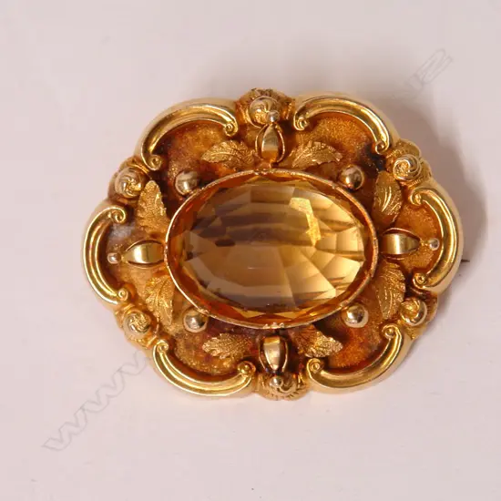 A 19thC 18ct. gilded yellow gold and citrine brooch