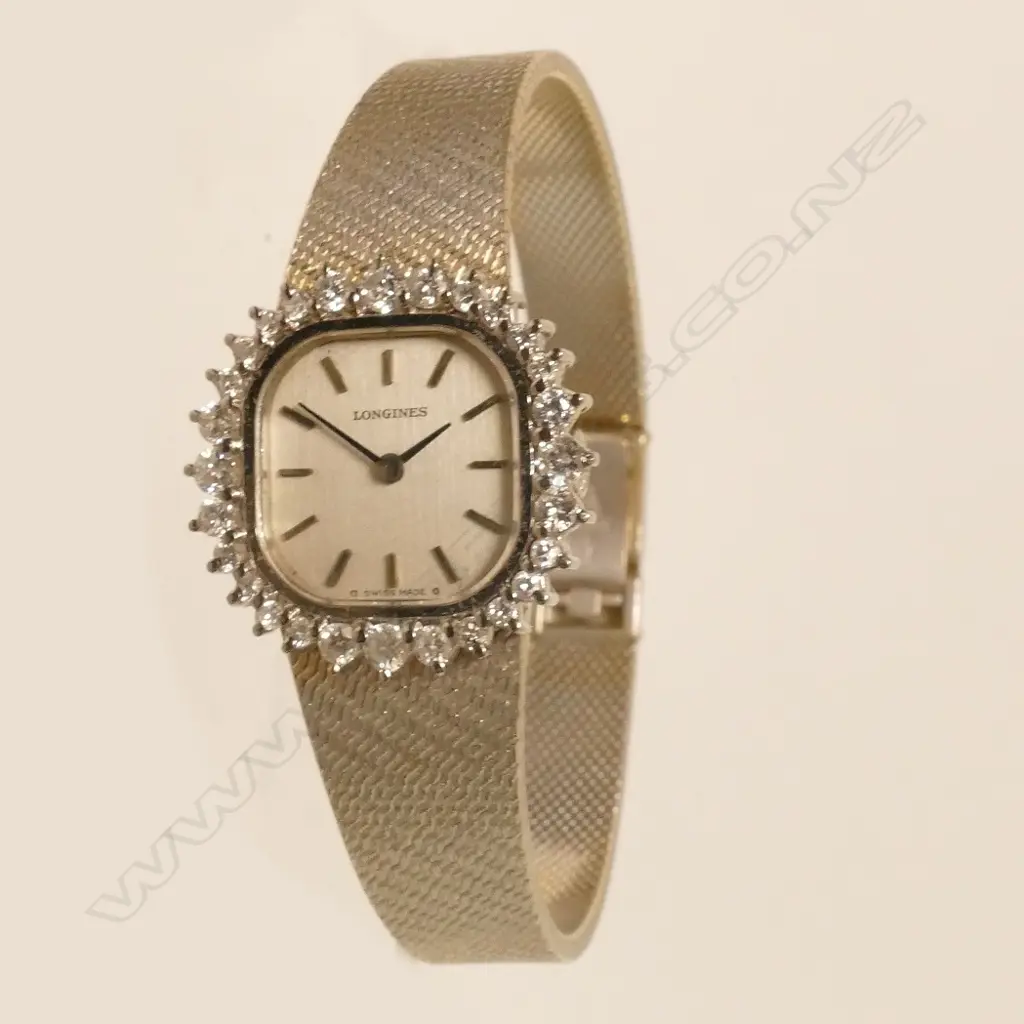 A lady's 18ct. white gold and diamond Longines wristwatch Image 1++