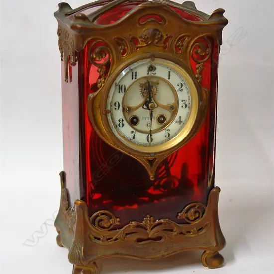 A rare late 19thC ruby glass and gilt metal Art Nouveau Gilbert Clock Co. mantel clock