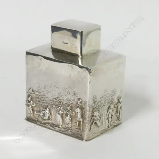 A small silver tea caddy