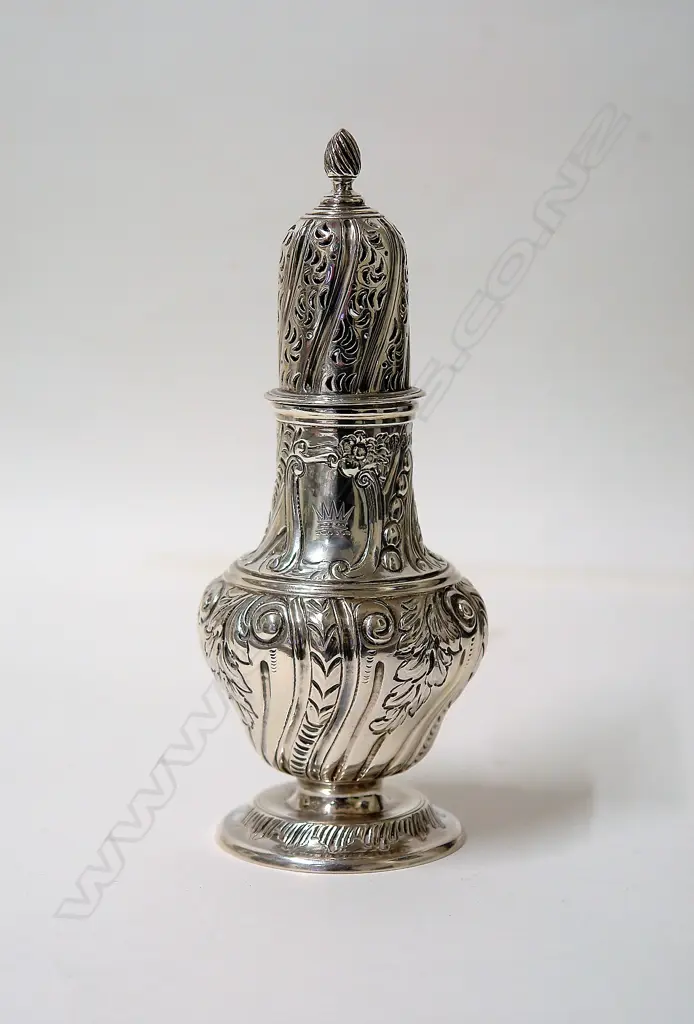 A Victorian embossed silver sugar caster Image 1++
