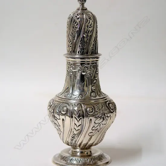 A Victorian embossed silver sugar caster