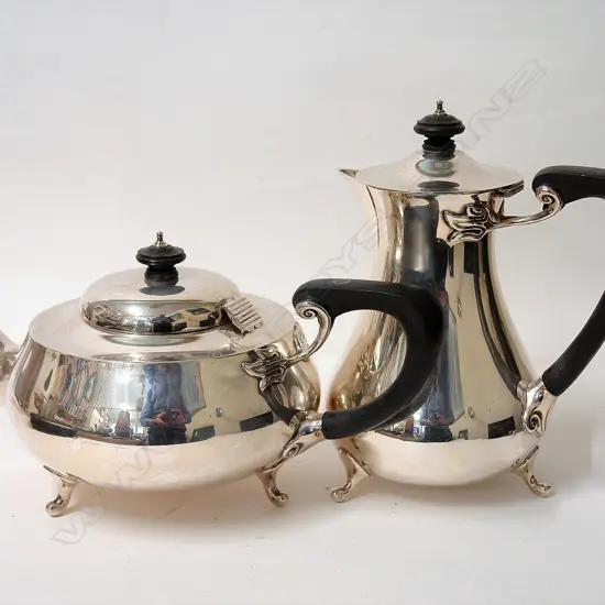 A 1920s silver teapot and hot water pot in Arts & Crafts plain design