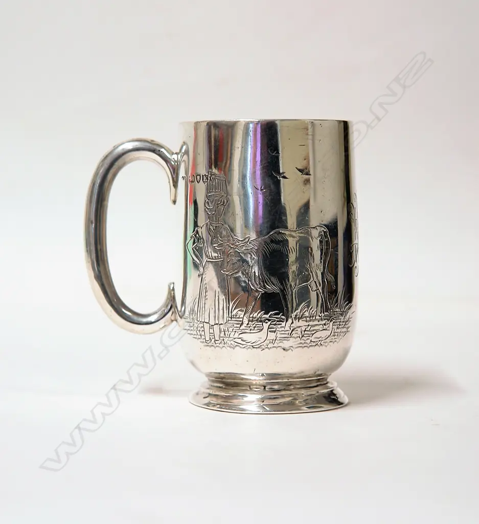 A Victorian silver picture engraved christening mug Image 1++