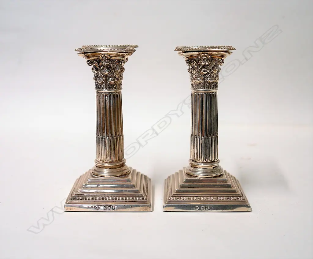A pair of Edwardian silver Corinthian column candlesticks Image 1++