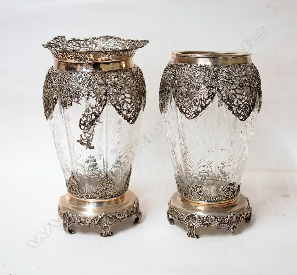 A pair of Edwardian elaborately silver mounted decorative glass vases Image 1++